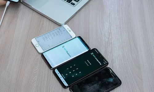 Developer reviewing code and monitoring system performance