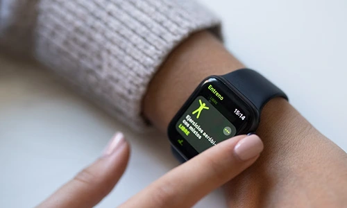 User interacting with a health and fitness app on a smartwatch
