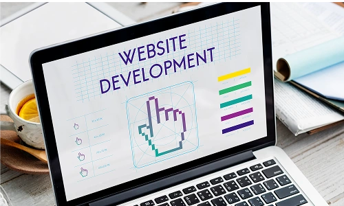 Developer working on a laptop with an Android logo